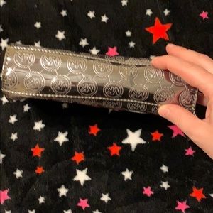 Michael Kors Bags - Michael Kors silver metallic pouch Michael Kors Bags - Michael Kors silver metallic pouch